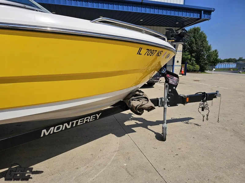 Slide: The Image of Yellow 2015 Monterey 196MFS boat on trailer, parked outdoors. - 14
