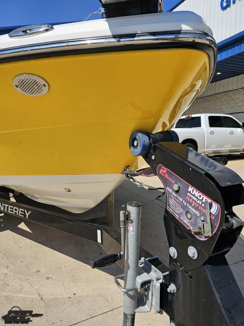 Slide: The Image of Yellow 2015 Monterey 196MFS boat on trailer, close-up of bow and winch. - 18