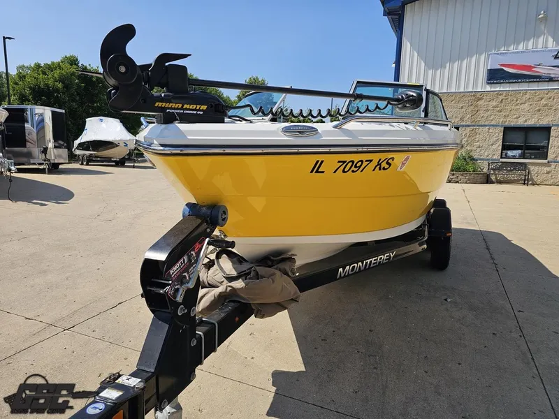 Slide: The Image of Yellow 2015 Monterey 196MFS boat on trailer, parked outdoors. - 21