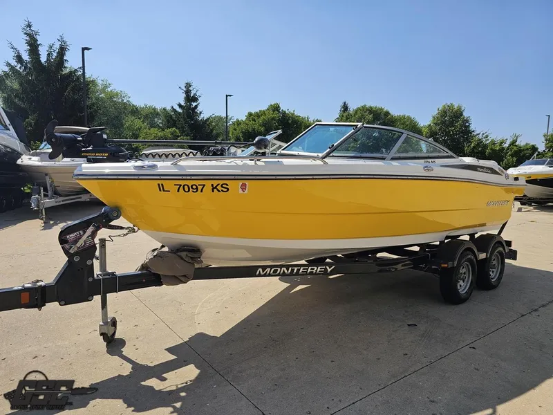 Slide: The Image of Yellow 2015 Monterey 196MFS boat on trailer, parked outdoors. - 24