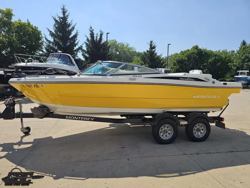 Slide: The Image of Yellow 2015 Monterey 196MFS boat on trailer, parked outdoors on a sunny day. - 26