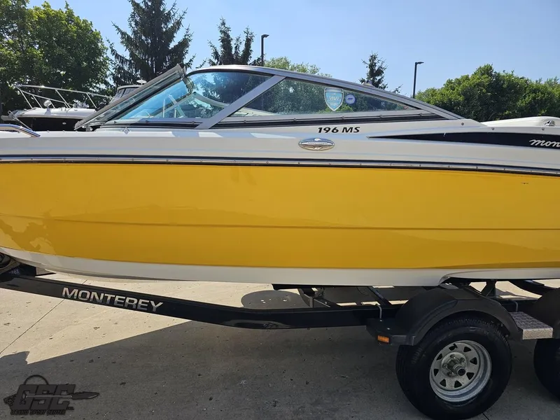 Slide: The Image of Yellow 2015 Monterey 196MFS boat on trailer, parked outdoors. - 27