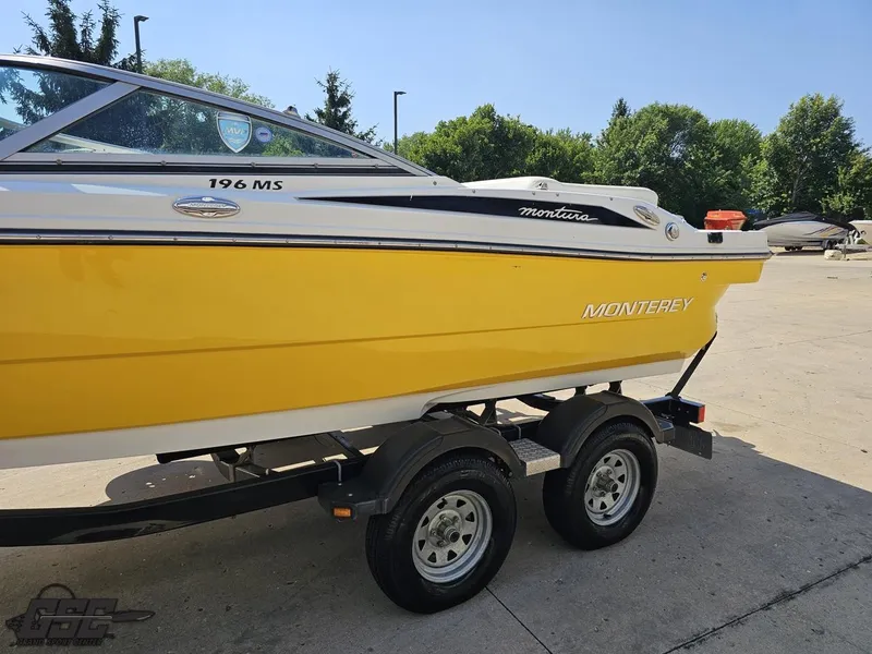 Slide: The Image of Yellow 2015 Monterey 196MFS boat on trailer, parked outdoors on sunny day. - 28