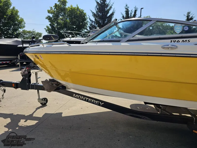 Slide: The Image of Yellow 2015 Monterey 196MFS boat on trailer, parked outdoors. - 29