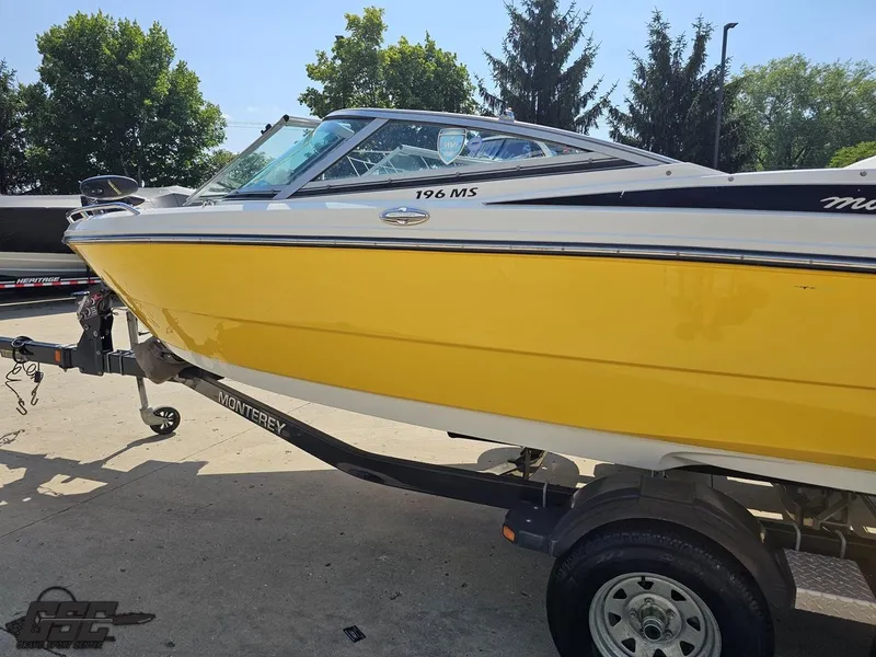 Slide: The Image of Yellow 2015 Monterey 196MFS boat on trailer, parked outdoors. - 30