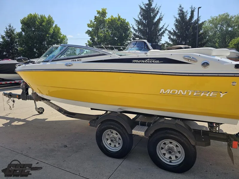 Slide: The Image of Yellow 2015 Monterey 196MFS boat on trailer, parked outdoors. - 31