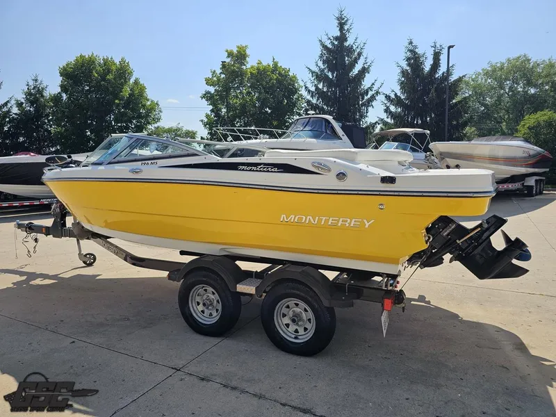 Slide: The Image of Yellow 2015 Monterey 196MFS boat on trailer, parked outdoors. - 32