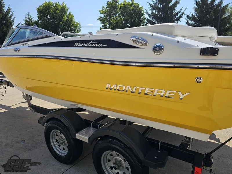Slide: The Image of Yellow 2015 Monterey 196MFS boat on trailer, parked outdoors. - 33