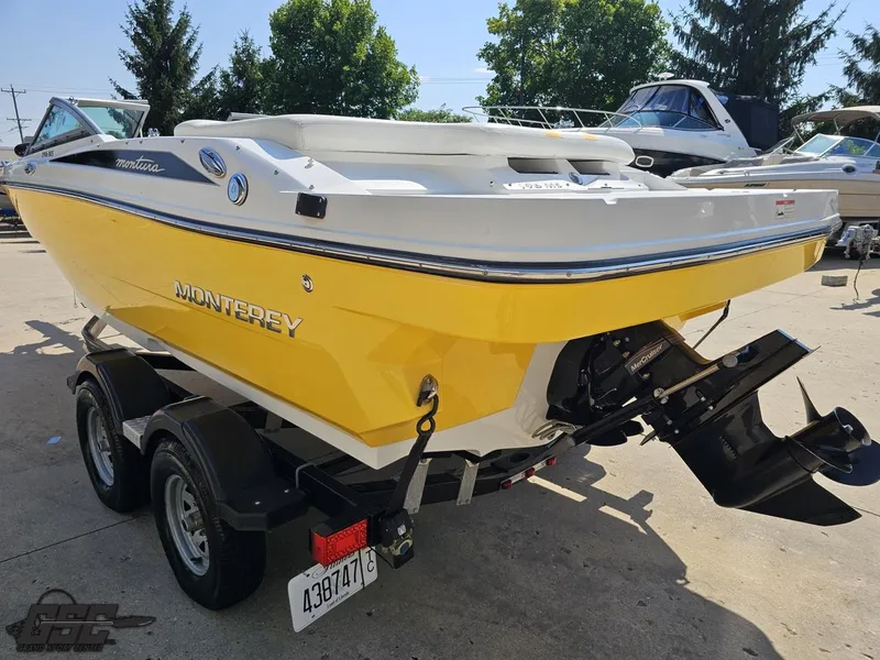 Slide: The Image of Yellow 2015 Monterey 196MFS boat on trailer, parked outdoors, sunny day. - 36