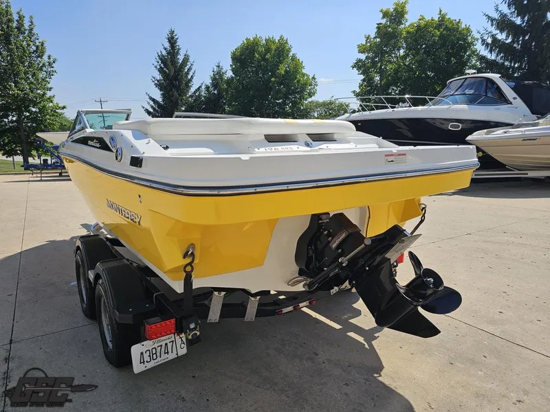 Slide: The Image of 2015 Monterey 196MFS boat in yellow, parked on a trailer in a sunny outdoor setting. - 37