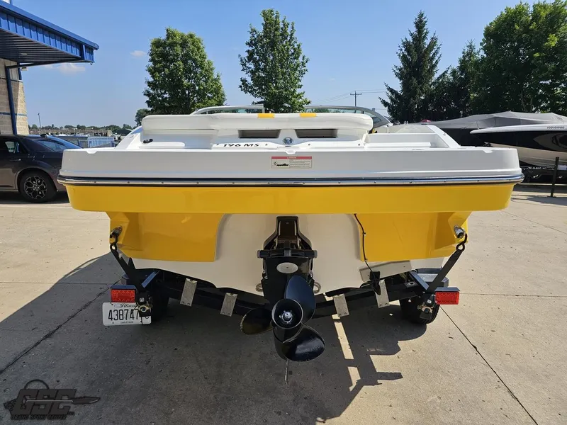 Slide: The Image of 2015 Monterey 196MFS boat, yellow and white, parked outdoors on a sunny day. - 38
