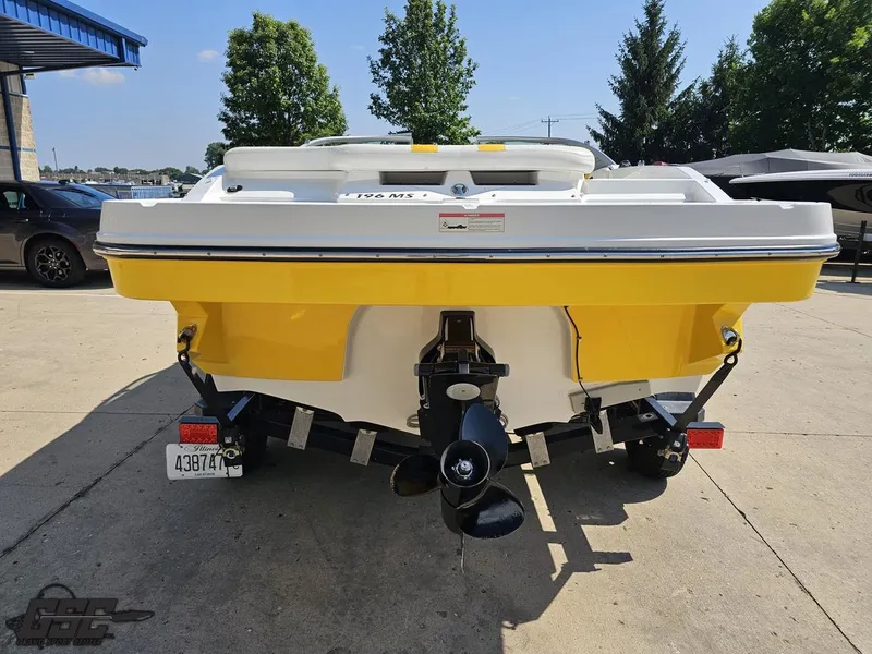 Slide: The Image of Yellow 2015 Monterey 196MFS boat on trailer, parked outdoors. - 39