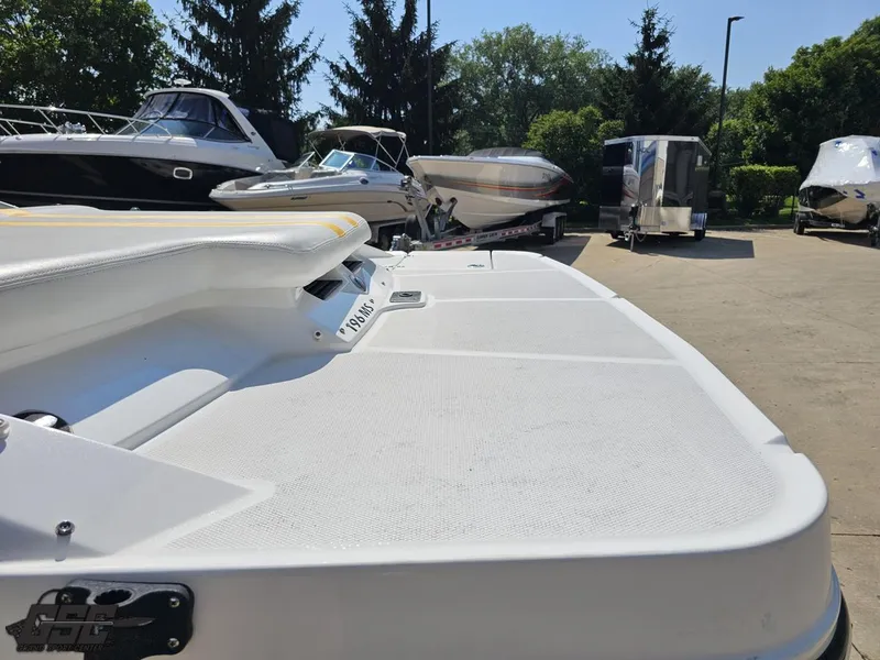 Slide: The Image of 2015 Monterey 196MFS boat in a marina, surrounded by other boats and trailers. - 44