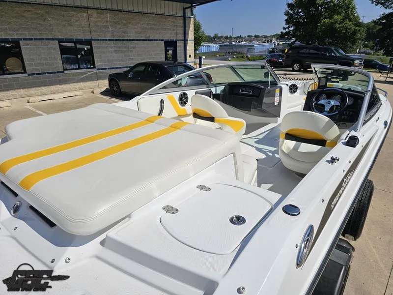 Slide: The Image of 2015 Monterey 196MFS boat with white and yellow seating, parked outdoors. - 45
