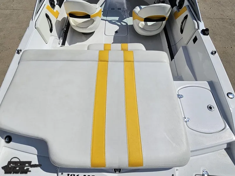 Slide: The Image of Interior of a 2015 Monterey 196MFS boat with yellow and white seating. - 47