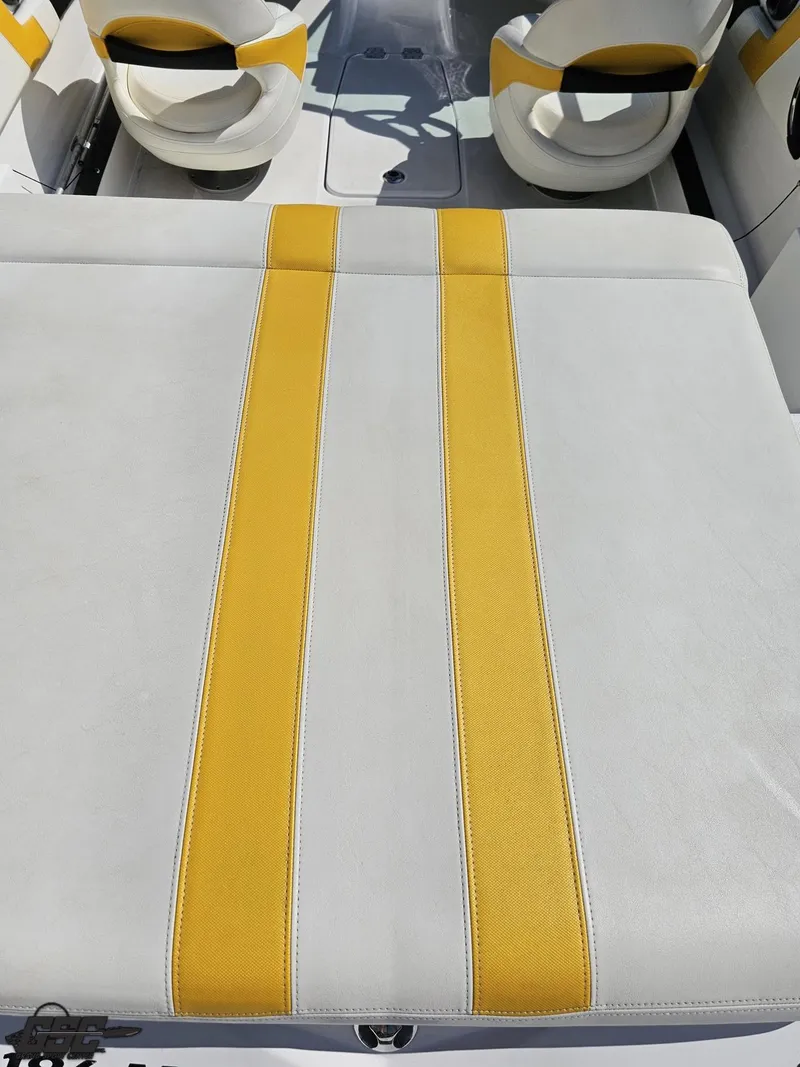 Slide: The Image of White and yellow seating on a 2015 Monterey 196MFS boat interior. - 48