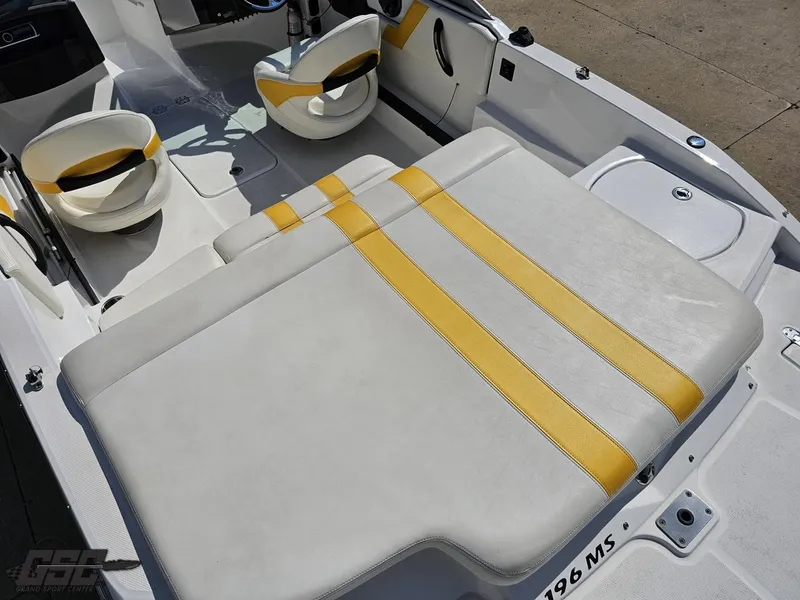 Slide: The Image of Interior of a 2015 Monterey 196MFS boat with yellow-striped seating. - 49