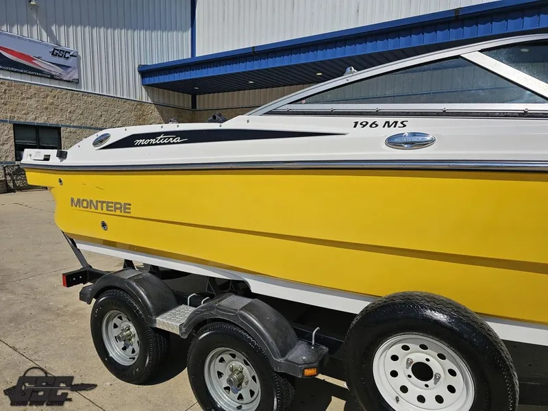 Slide: The Image of Yellow 2015 Monterey 196MFS boat on trailer outside a building. - 8