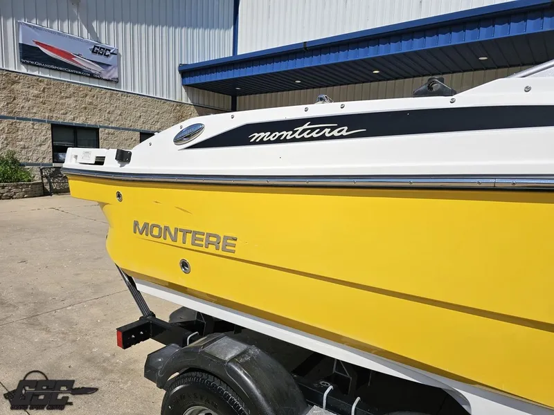Slide: The Image of Yellow 2015 Monterey 196MFS boat on trailer outside a building. - 9
