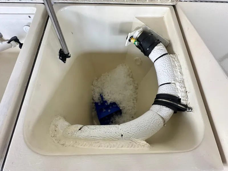 Slide: The Image of Ice maker compartment on a 1988 Hatteras Enclosed Bridge Sportfish boat. - 29