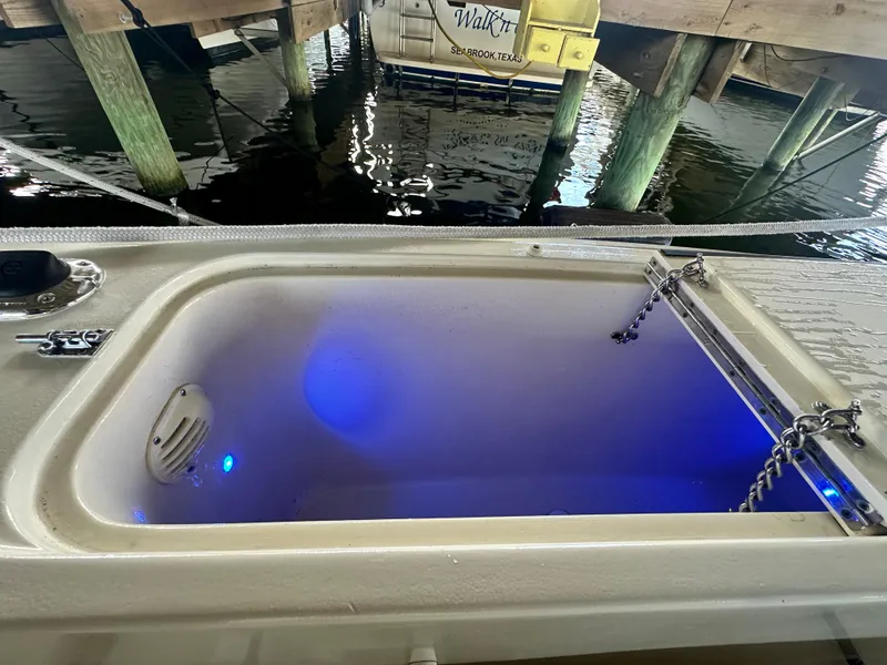 Slide: The Image of Livewell with blue lighting on 1988 Hatteras Enclosed Bridge Sportfish boat. - 30