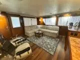 Slide: The Image of Interior of 1988 Hatteras Enclosed Bridge Sportfish yacht with cozy seating and elegant decor. - 41