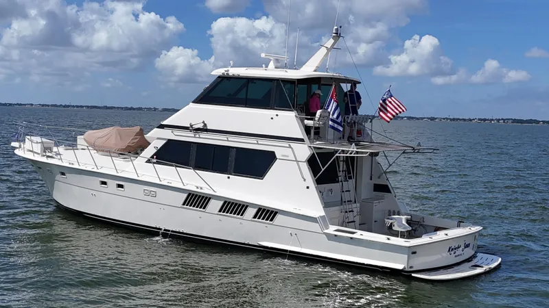 Slide: The Image of 1988 Hatteras Enclosed Bridge Sportfish yacht cruising on a sunny day. - 11