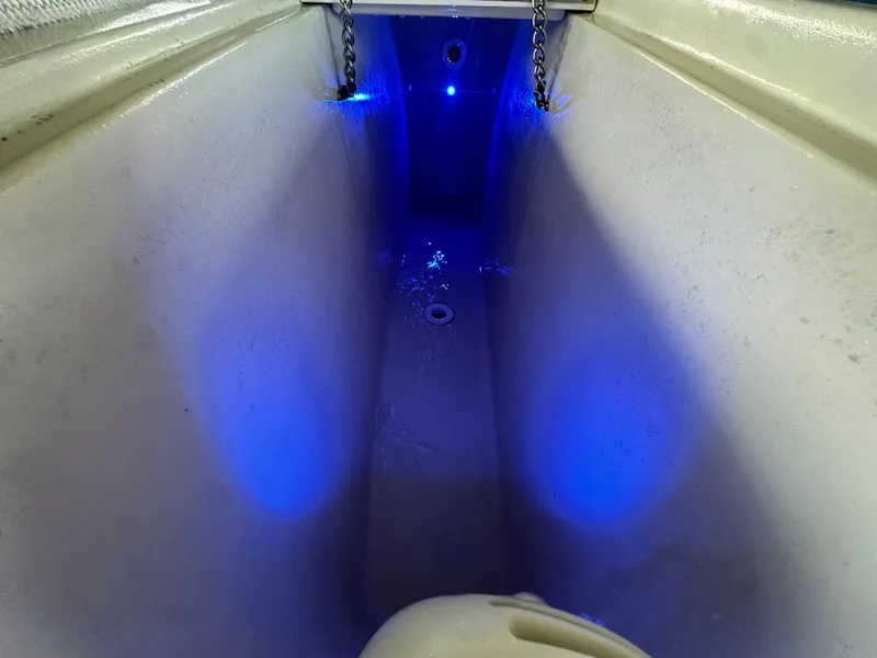 Slide: The Image of 1988 Hatteras Enclosed Bridge Sportfish interior with blue LED lighting. - 31