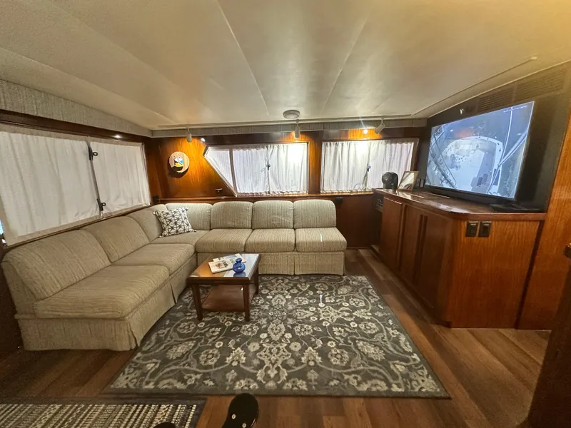 Slide: The Image of Luxurious 1988 Hatteras Enclosed Bridge Sportfish interior with cozy seating and elegant decor. - 40