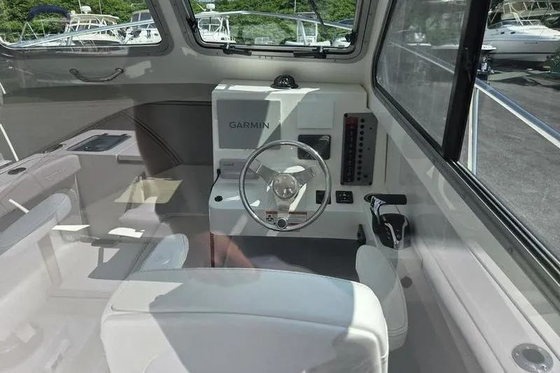 Slide: The Image of Interior of 2026 Parker 2220 Sport Cabin boat with Garmin navigation system. - 12