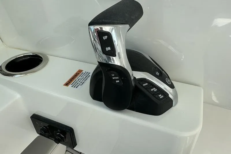 Slide: The Image of Throttle control lever on 2026 Parker 2220 SPORT CABIN boat dashboard. - 15