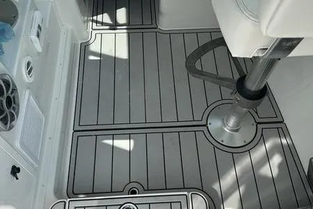Slide: The Image of 2026 Parker 2220 SPORT CABIN boat interior with sleek, modern flooring and seating. - 19