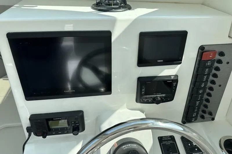 Slide: The Image of Dashboard of 2026 Parker 2220 SPORT CABIN with Garmin and Yamaha displays. - 21