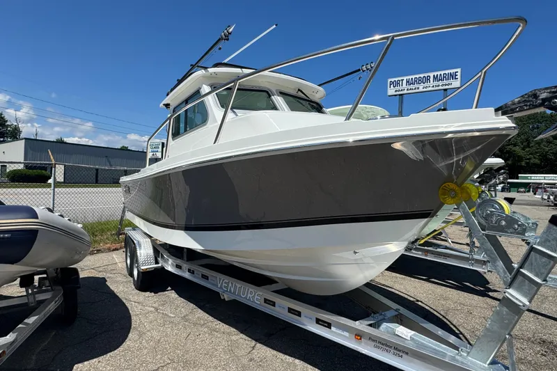 Slide: The Image of 2025 Parker 2220 SC boat on trailer at Port Harbor Marine dealership. - 1
