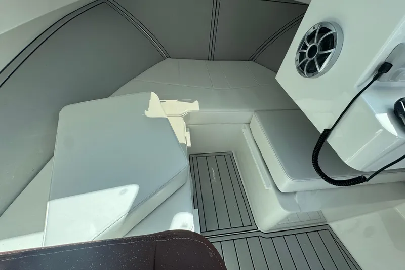 Slide: The Image of Interior of 2025 Parker 2220 SC boat with seating and speaker system. - 12