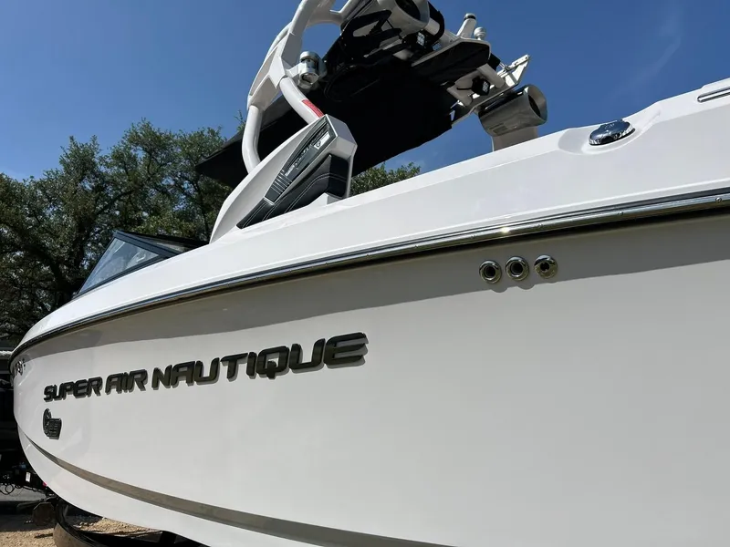 Slide: The Image of 2014 Nautique Super Air Nautique G23 boat, white exterior, close-up view. - 16