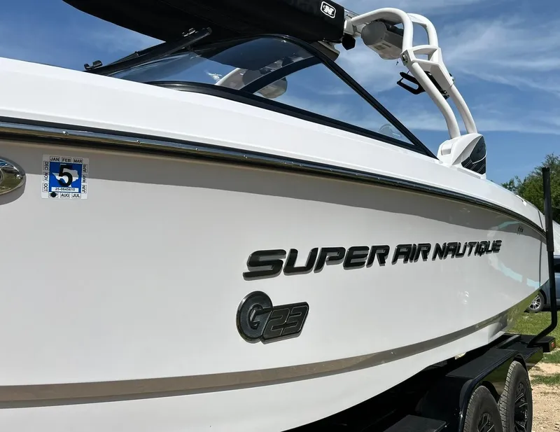 Slide: The Image of 2014 Nautique Super Air Nautique G23 boat on trailer, side view. - 18