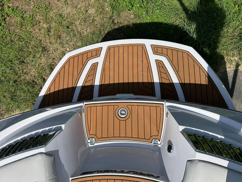 Slide: The Image of 2014 Nautique Super Air Nautique G23 boat deck with teak flooring, viewed from above. - 25