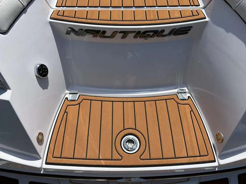 Slide: The Image of 2014 Nautique Super Air Nautique G23 boat deck with teak finish. - 27