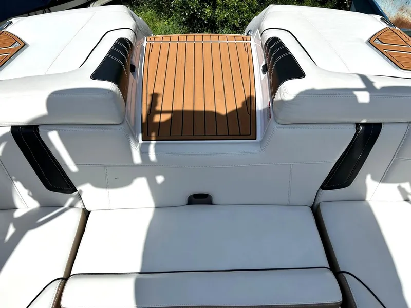 Slide: The Image of 2014 Nautique Super Air Nautique G23 boat interior with white seating and teak accents. - 33