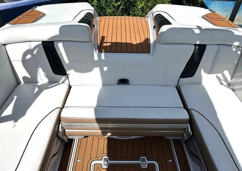 Slide: The Image of 2014 Nautique Super Air Nautique G23 interior with white seating and teak flooring. - 40