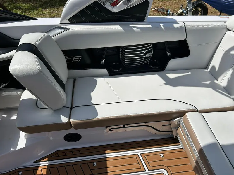 Slide: The Image of 2014 Nautique Super Air Nautique G23 interior seating with white upholstery and teak flooring. - 41