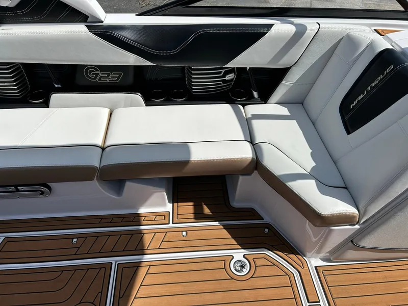Slide: The Image of 2014 Nautique Super Air Nautique G23 interior seating with teak flooring and stylish design. - 44