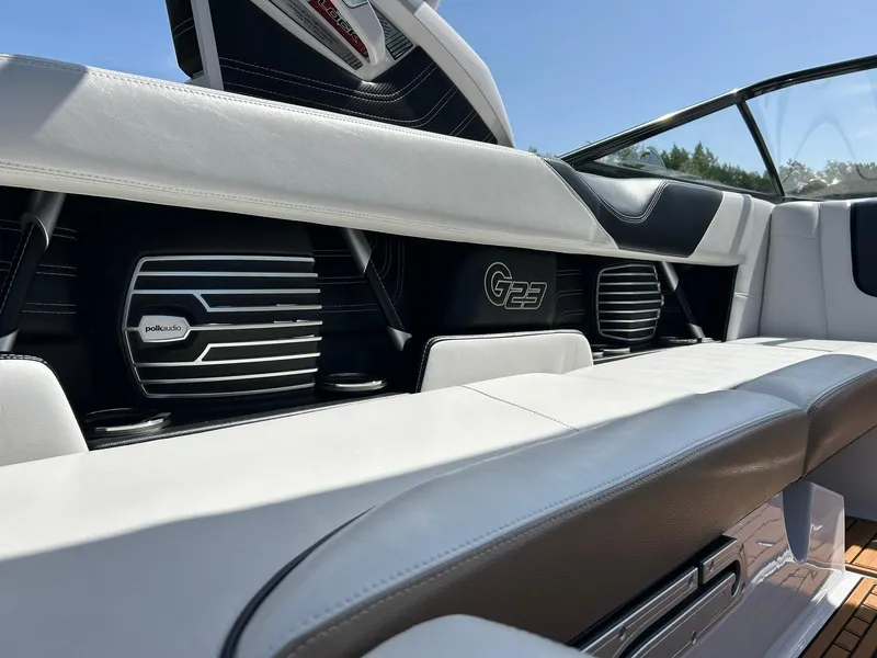 Slide: The Image of 2014 Nautique Super Air Nautique G23 interior with Polk Audio speakers and sleek seating. - 46