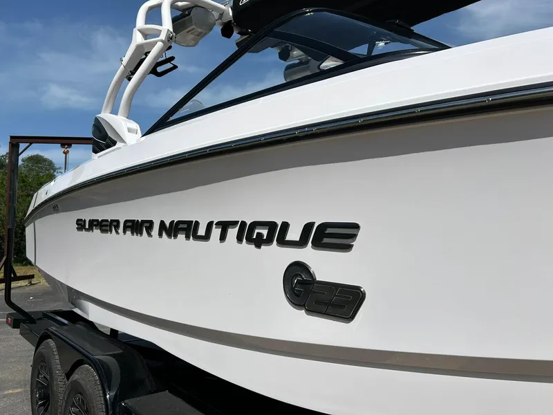 Slide: The Image of 2014 Nautique Super Air Nautique G23 boat on trailer, side view. - 9