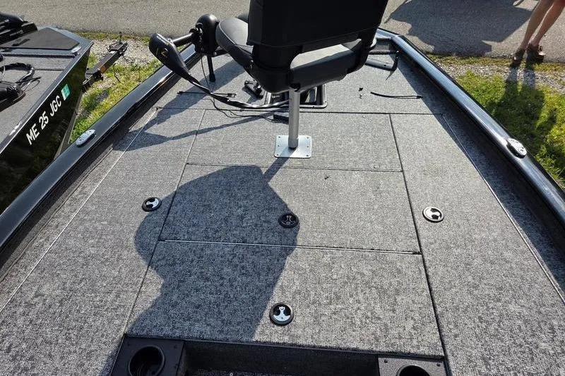 Slide: The Image of 2026 Tracker PT 195 TXW TE boat deck with swivel seat and fishing rod holders. - 10