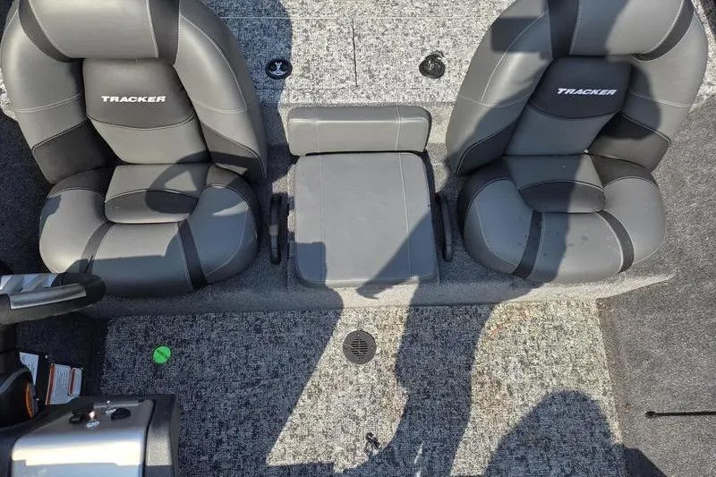 Slide: The Image of 2026 Tracker PT 195 TXW TE boat interior with two seats and center console. - 11