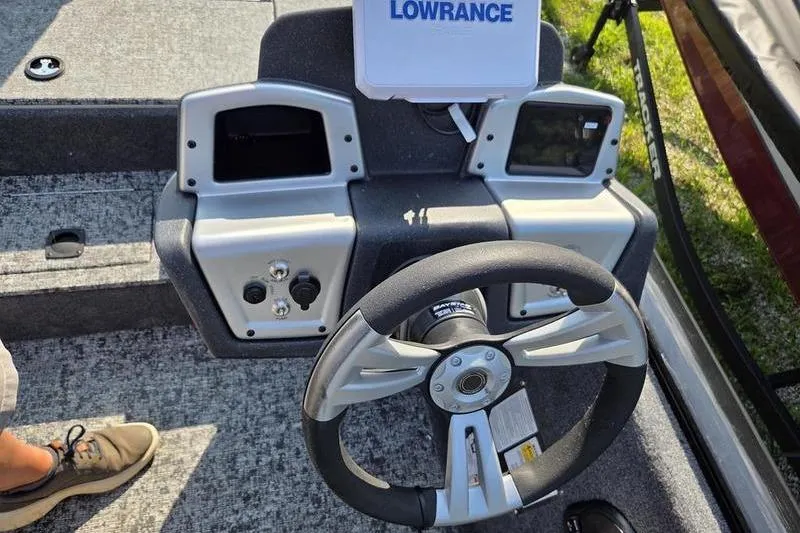 Slide: The Image of Steering console of 2026 Tracker PT 195 TXW TE boat with Lowrance electronics. - 12