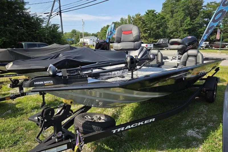 Slide: The Image of 2026 Tracker PT 195 TXW TE fishing boat on trailer, equipped with Minn Kota motor. - 4