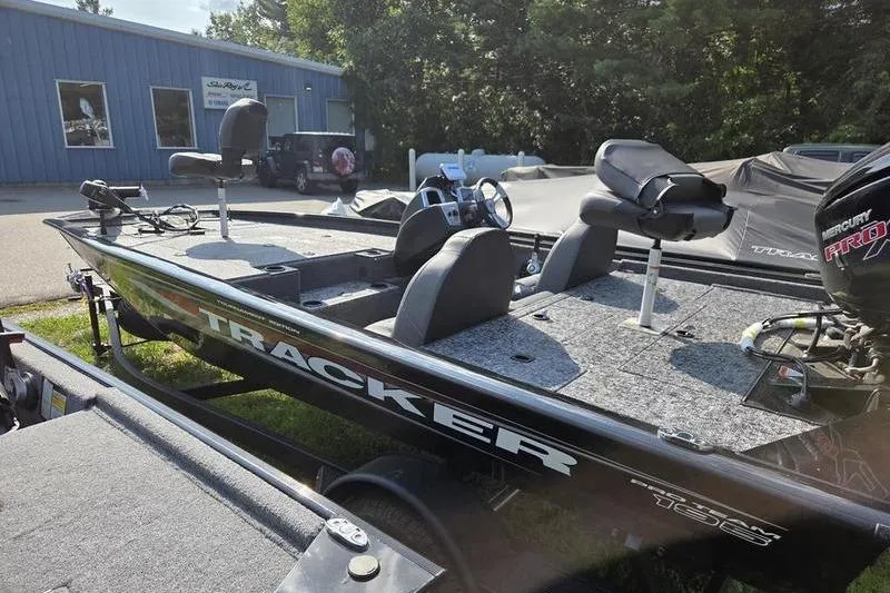 Slide: The Image of 2026 Tracker PT 195 TXW TE fishing boat with seating and Mercury engine. - 7